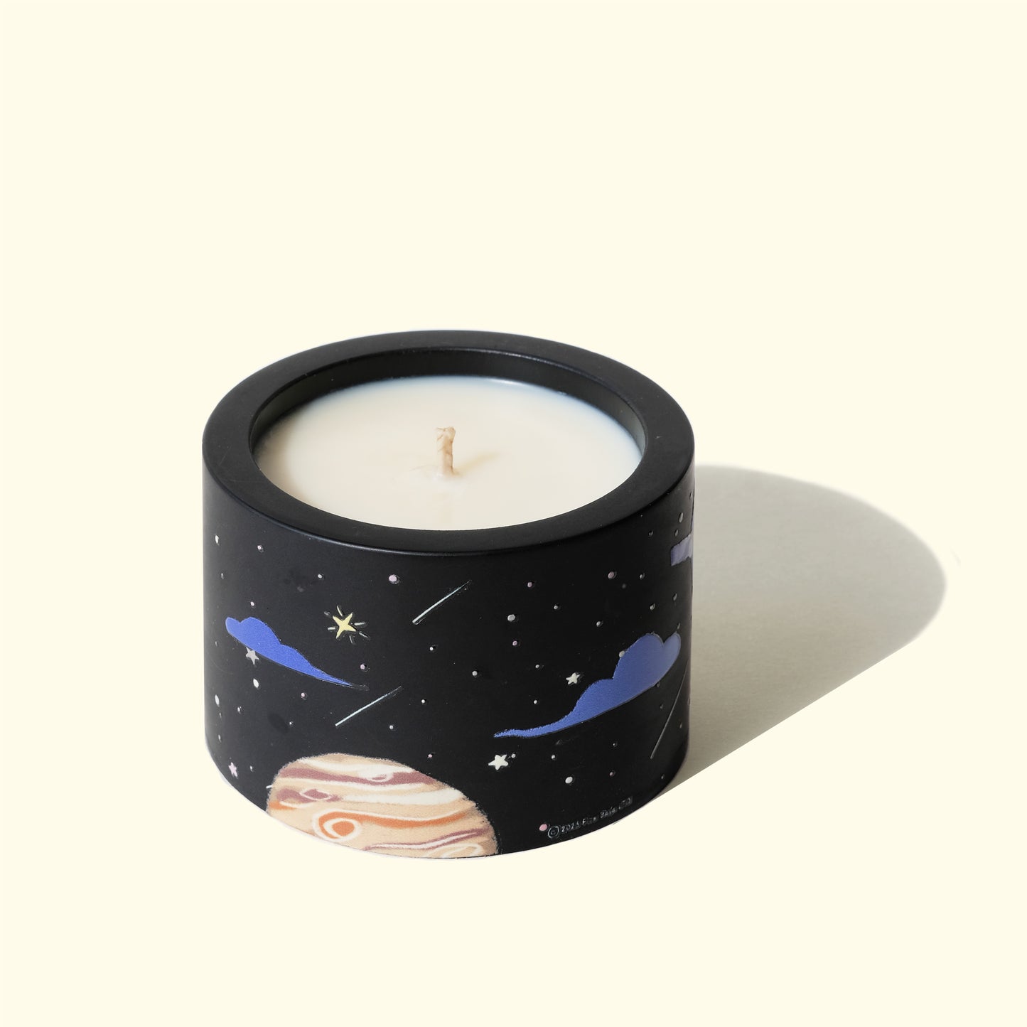 Back side of Midnight natural essential oil candle with illustrated night sky vessel