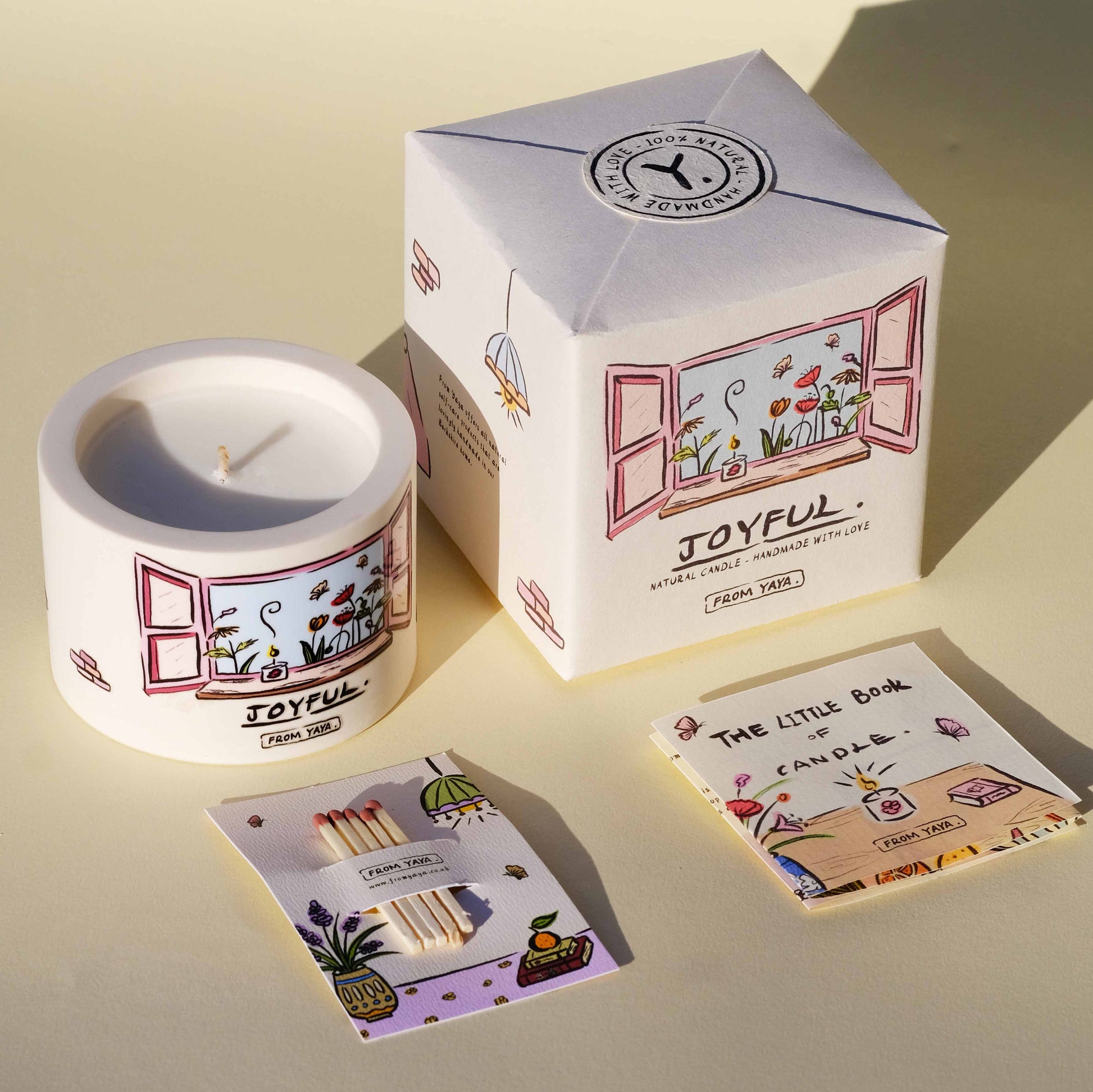 Small Joyful essential oil candle with packaging, matches and the little book of candle descriptive book. All illustrated with cute, personal designs.